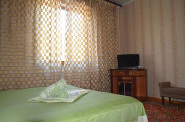 Фото номера Стандартный двухместный номер с 1 кроватью Гостевой дом Lotos Guest House г. Бишкек 5