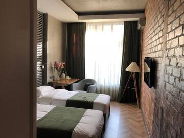 Фото номера Бюджетный двухместный номер с 2 отдельными кроватями Отель Bugu Hotel Bishkek г. Бишкек 10