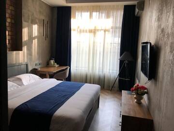 Фото номера Бюджетный одноместный номер Отель Bugu Hotel Bishkek г. Бишкек 3