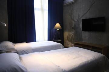 Фото номера Просторный двухместный номер с 2 отдельными кроватями Отель Bugu Hotel Bishkek г. Бишкек 3