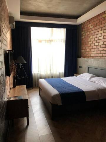 Фото номера Просторный двухместный номер с 2 отдельными кроватями Отель Bugu Hotel Bishkek г. Бишкек 15