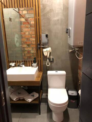 Фото номера Бюджетный двухместный номер с 2 отдельными кроватями Отель Bugu Hotel Bishkek г. Бишкек 2