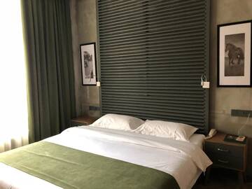 Фото номера Бюджетный двухместный номер с 1 кроватью Отель Bugu Hotel Bishkek г. Бишкек 4