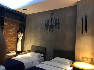 Фото номера Бюджетный двухместный номер с 2 отдельными кроватями Отель Bugu Hotel Bishkek г. Бишкек 6