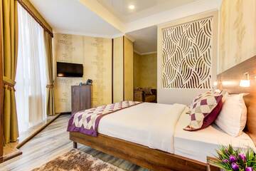 Фото номера Номер Делюкс (для 2 взрослых и 1 ребенка) Отель Bishkek Centrum Hotel г. Бишкек 3