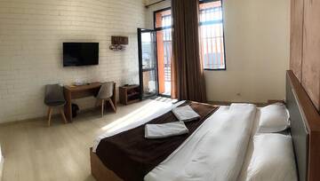 Фото номера Номер с кроватью размера «king-size» Отель Concord Hotel г. Бишкек 19