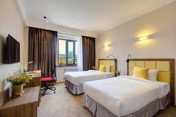 Фото номера Двухместный номер Делюкс с 2 отдельными кроватями Отель Garden Hotel &amp; SPA г. Бишкек 4