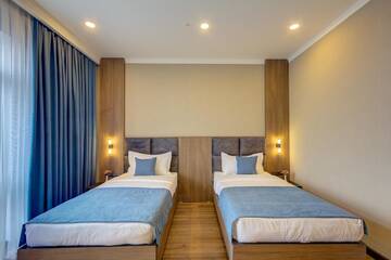 Фото номера Улучшенный двухместный номер с 2 отдельными кроватями Отель Sara Boutique Hotel г. Бишкек 7
